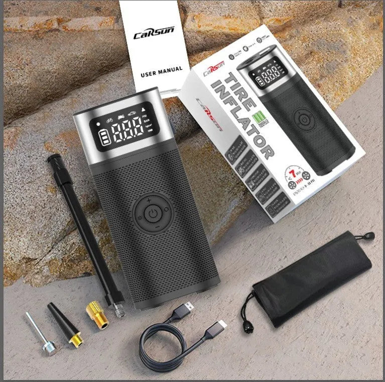 Black portable wireless smart vehicle air pump with USB-C cable and multiple nozzles on a grey background.