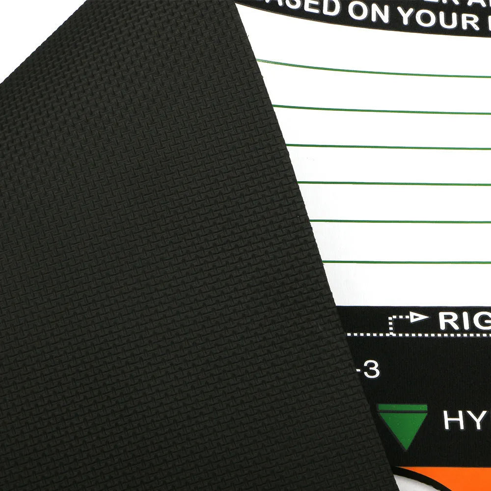 Black neoprene golf swing posture correction pad on a green surface