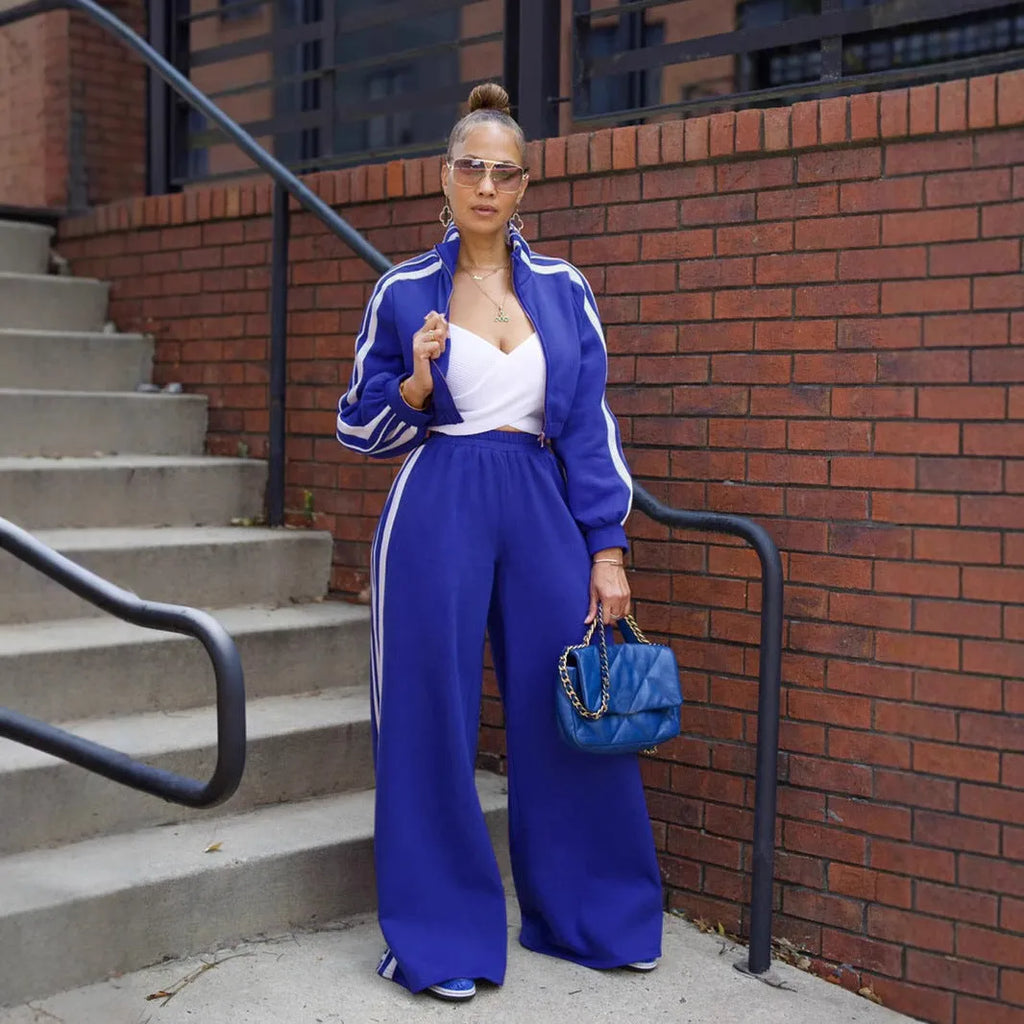 Grey striped streetwear two-piece set featuring a sweater with regular sleeves and matching trousers.