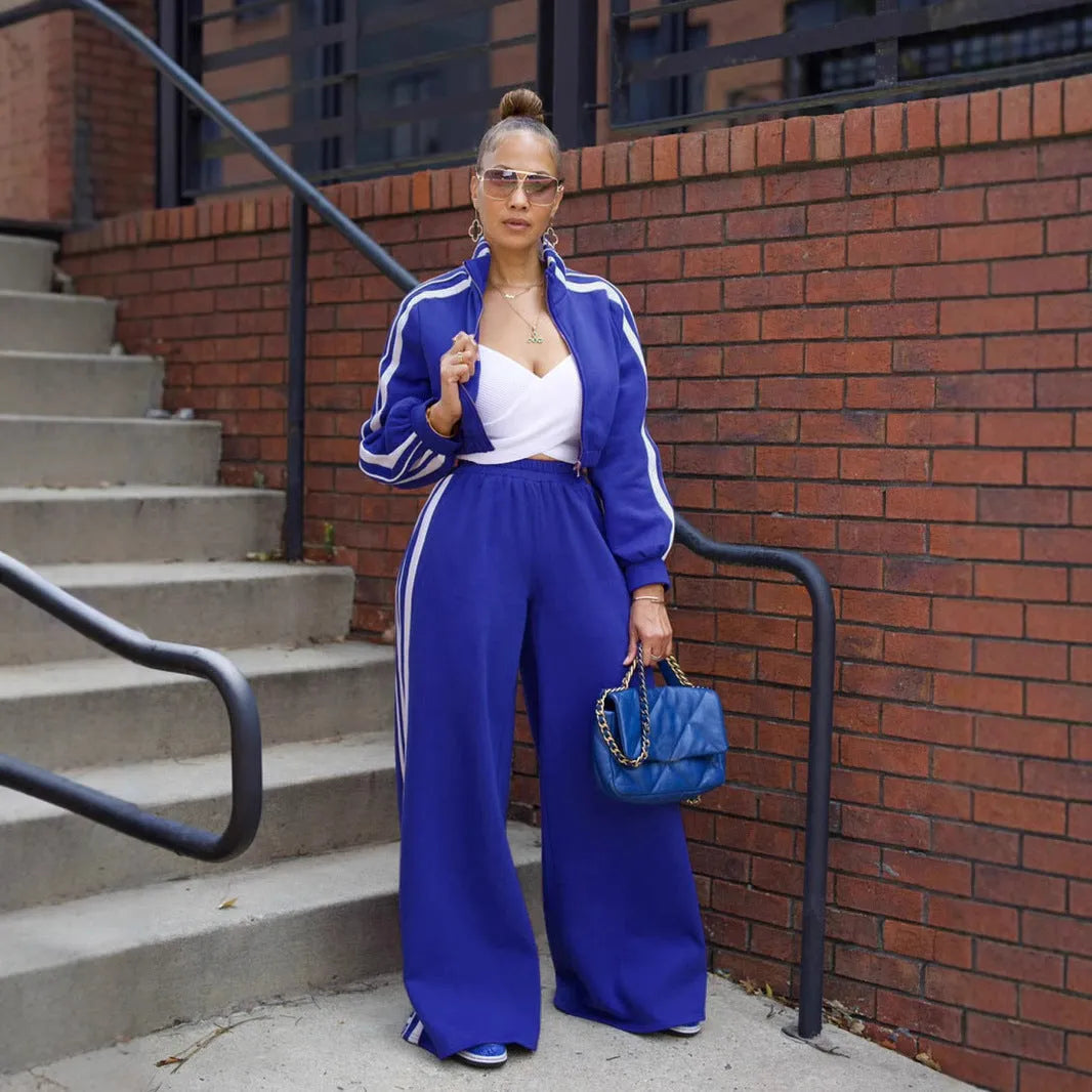 Grey striped streetwear two-piece set featuring a sweater with regular sleeves and matching trousers.