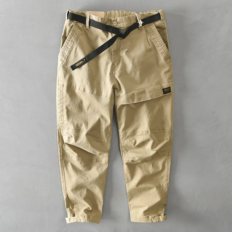 Men's loose-fit cotton overalls in army green colour, showing casual Japanese style and mid-waist design.