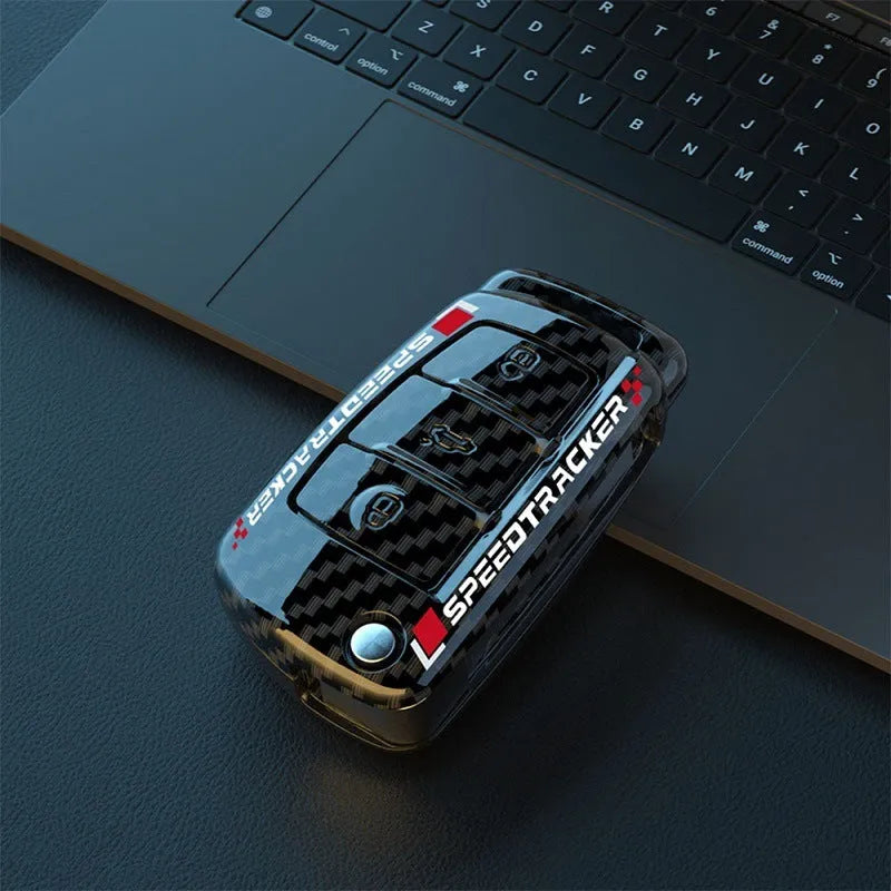 Carbon fibre style car key cover with mirror in feilin material, shown in carbon colour.
