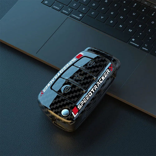 Carbon fibre style car key cover with mirror in feilin material, shown in carbon colour.