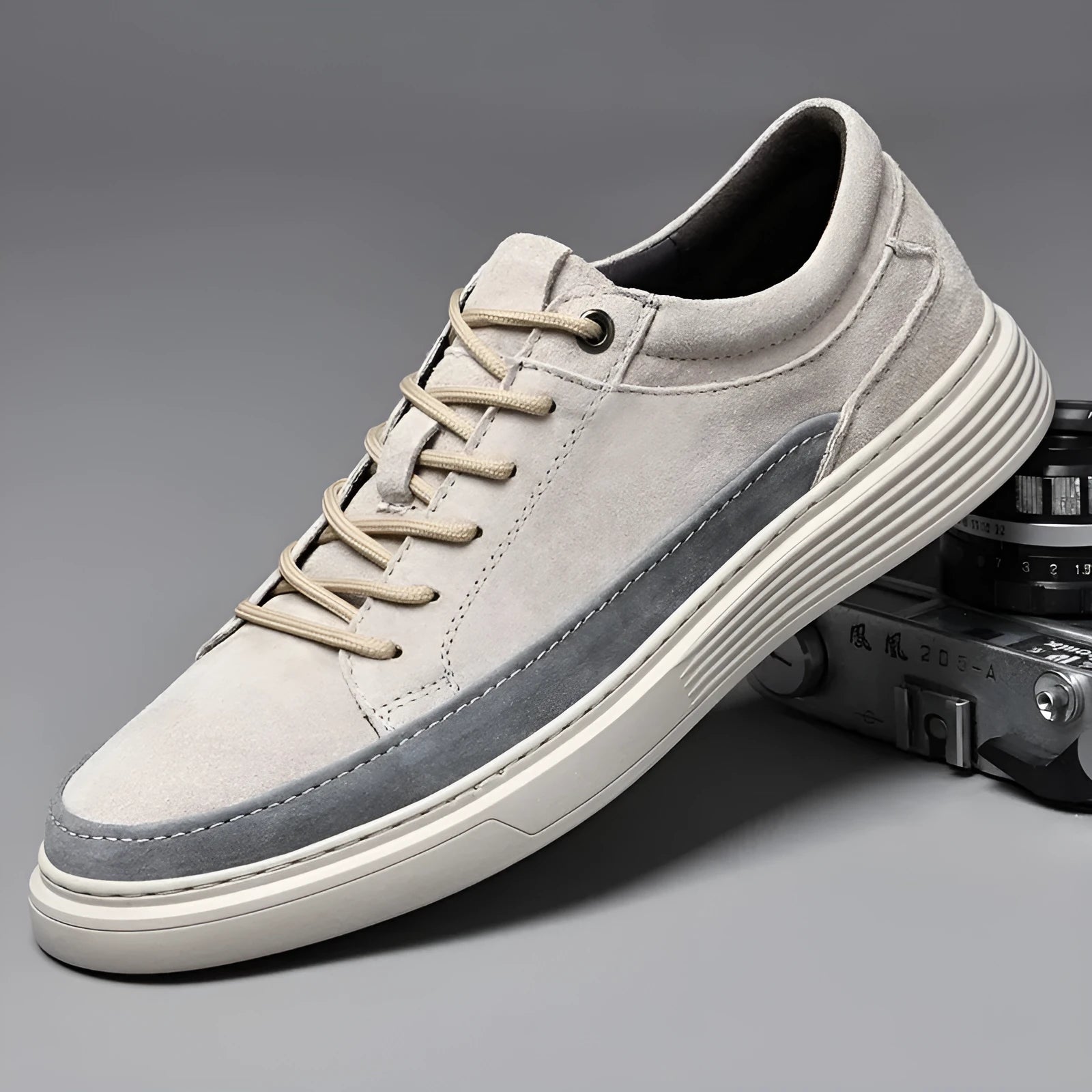 Men's grey casual skate shoes with pigskin upper and rubber sole on a white background