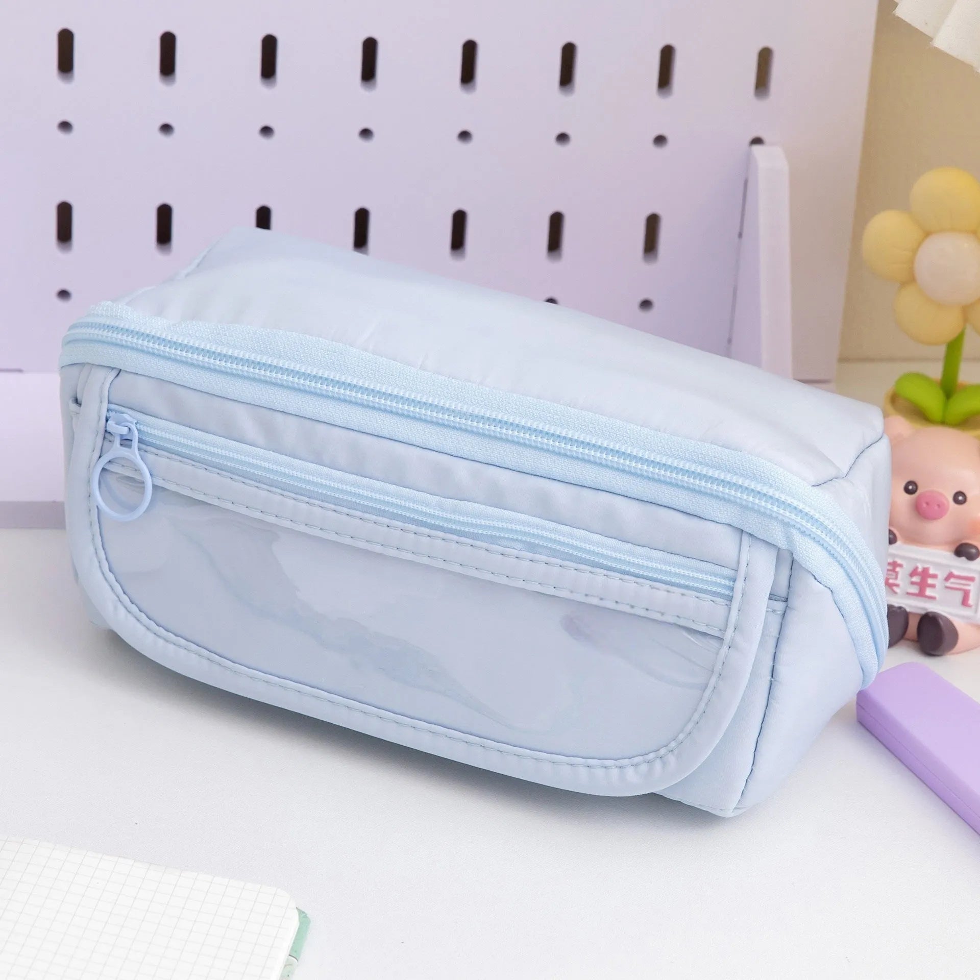 Korean-style canvas pencil case with a ten-layer flip design shown in various colours.