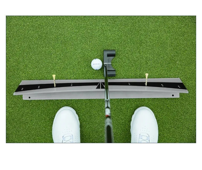 Adjustable golf putter balance simulator with PVC construction on a flat surface.