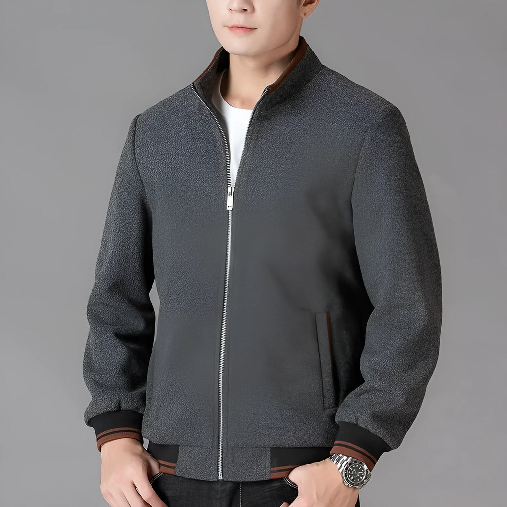 Men's grey zip-up fleece jacket with a stick pocket, shown in a sports style.