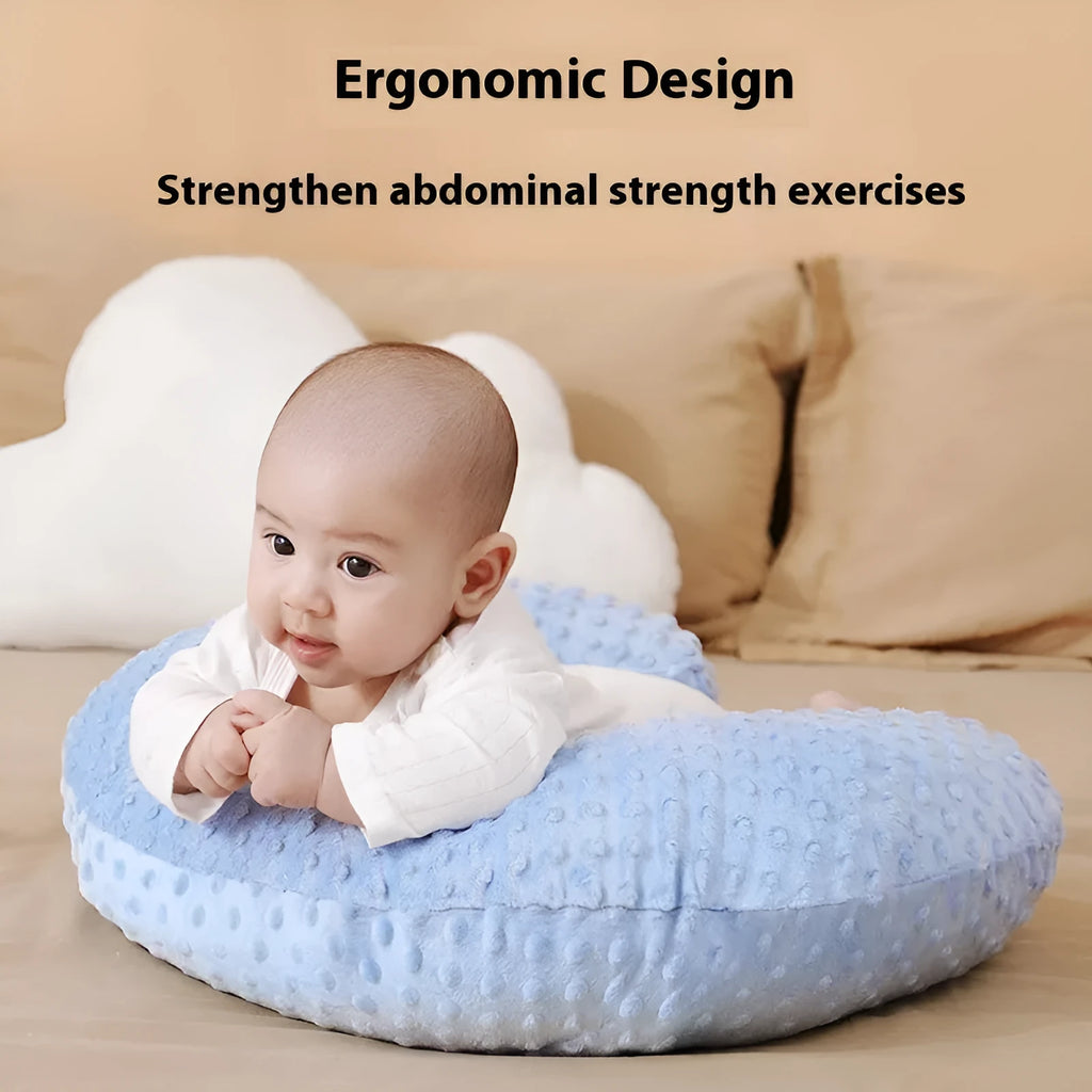 Multifunctional nursing pillow with a removable cover in grey, designed for feeding support and spill prevention.