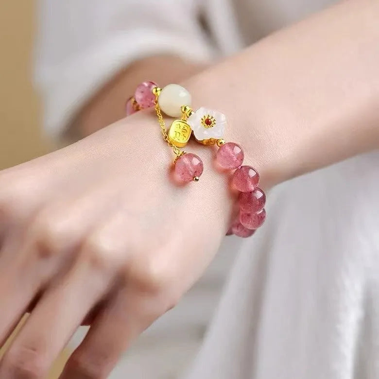 Handmade strawberry quartz crystal bracelet with Hetian jade peach blossom design showing five style variations