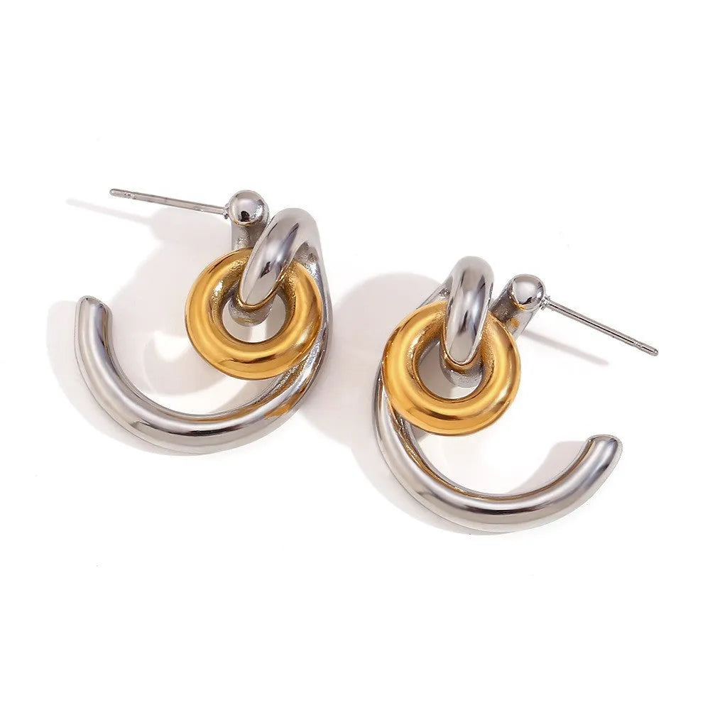 Gold tone geometric jewellery set including earrings, bracelet and necklace with round ring design elements