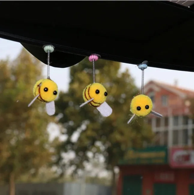 Cartoon bee car decoration ornament with furry ball material measuring 3x3cm