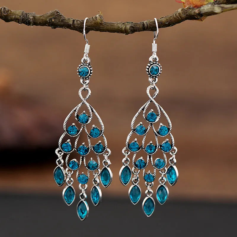 Retro purple drop earrings with long fringe detailing and ethnic design elements