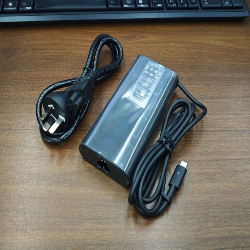 Black 65W USB Type-C laptop power adapter with international power cords