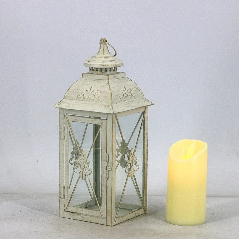 Black and white wrought iron floor-standing storm lantern with tempered glass panels for courtyard use