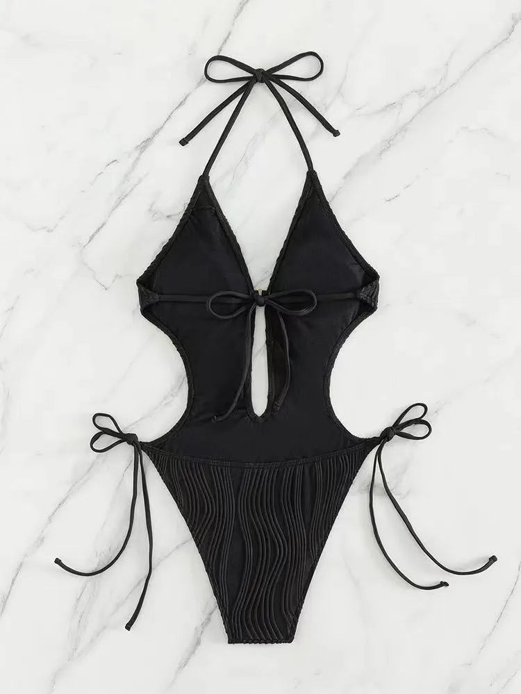 Women's black lace-up triangle bikini swimsuit with tie detail and solid colour design