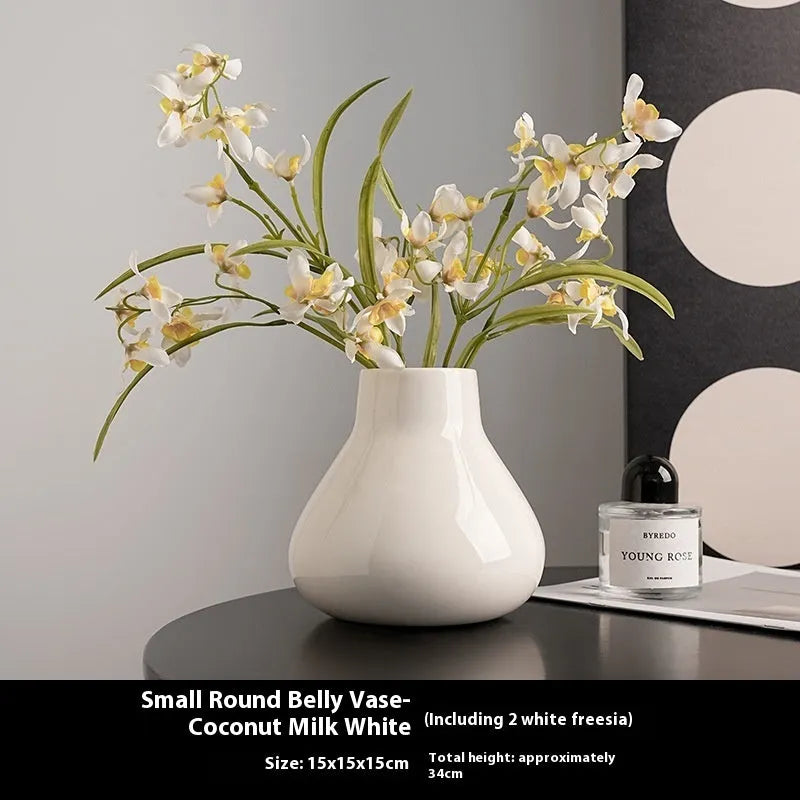 Black ceramic round belly French design vase with two white orchid flowers