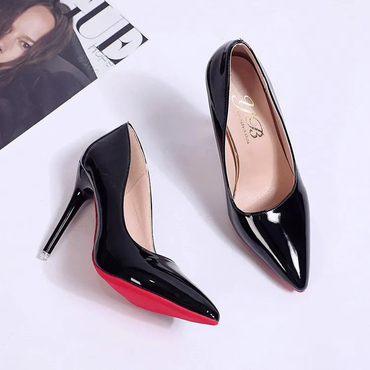 Women's solid colour pointed toe stiletto heel pumps on a white background.