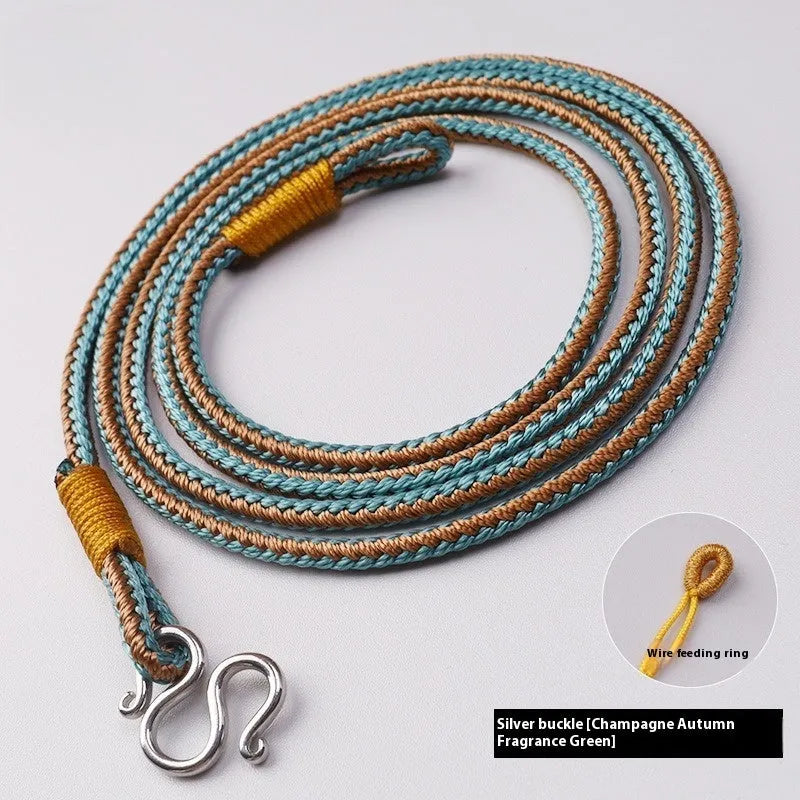 Gold peace buckle choker necklace with intricate mixed gemstone inlaid pendant on a model.