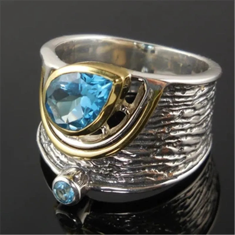 Blue drop-shaped zircon ring with rhinestone inlay on an alloy band, shown in women's sizes 6 to 10.