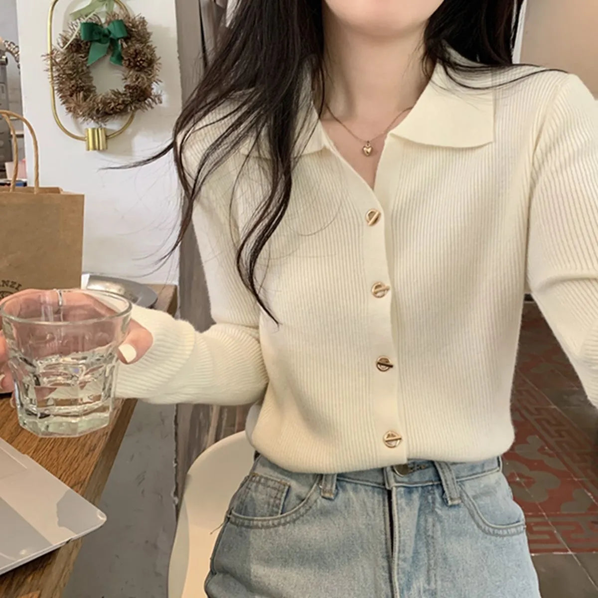 Long sleeved loose fit knitted cardigan top in viscose fibre, shown in beige colour.