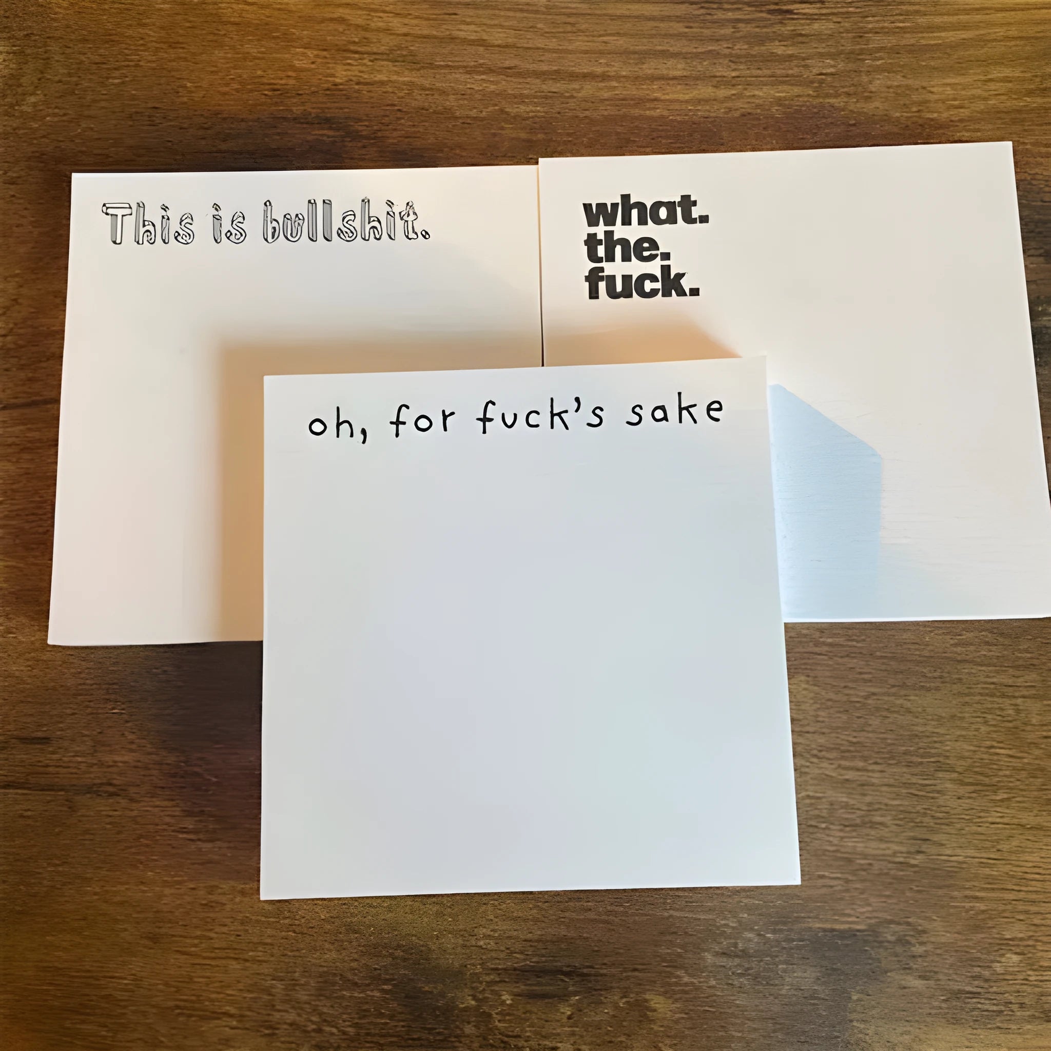 Square 75mm sticky notes with printed covers including 'Fuck Sticky Notes' design