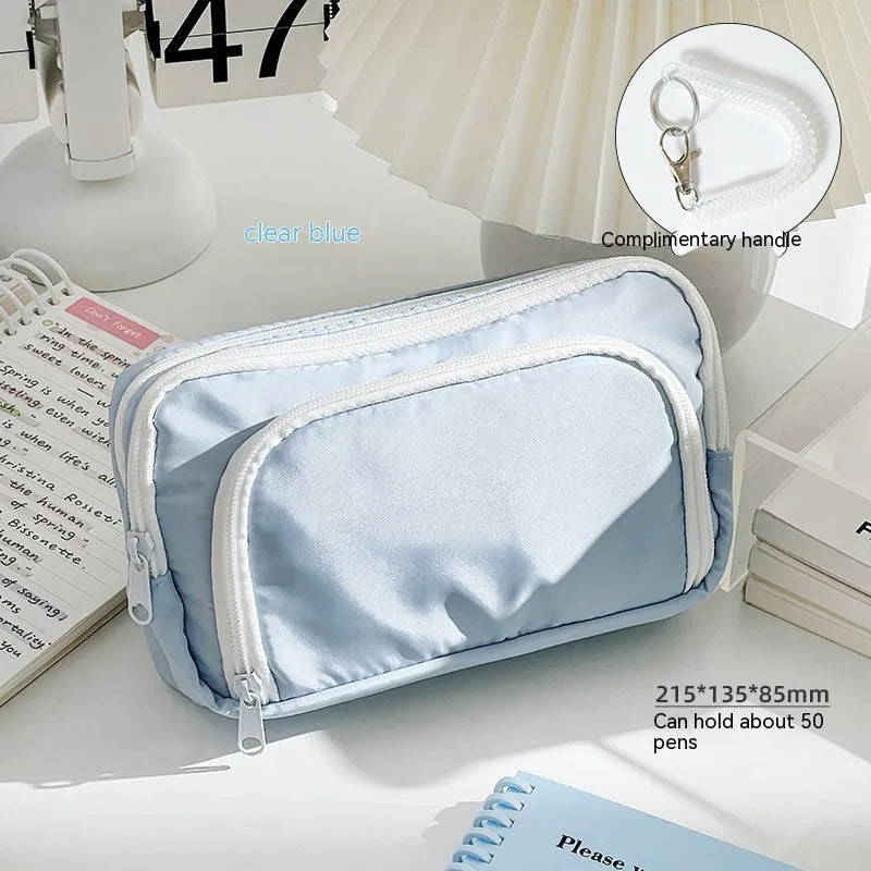 Double layer pencil case in blue, pink, cream, or green with gift handle, dimensions 215x135x85mm