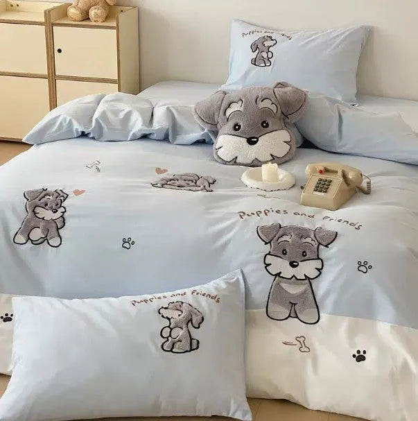Cartoon Schnauzer embroidered bedding set with quilt cover, sheet, and pillowcases on bed