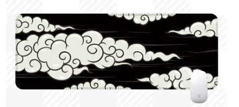 Large cloud pattern rubber desk mat with non-slip base on wooden desk surface