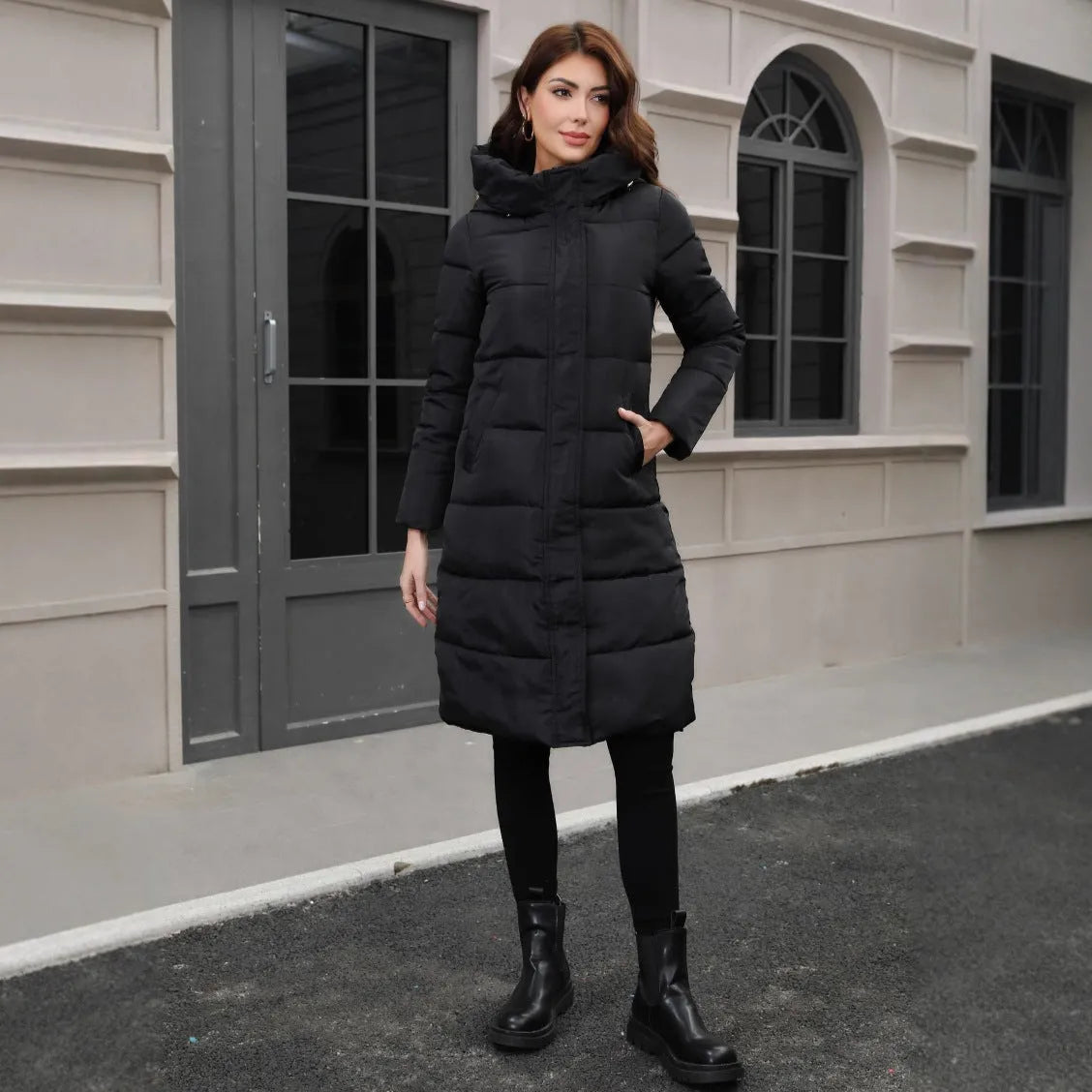 Black hooded slim fit cotton jacket with long sleeves on mannequin