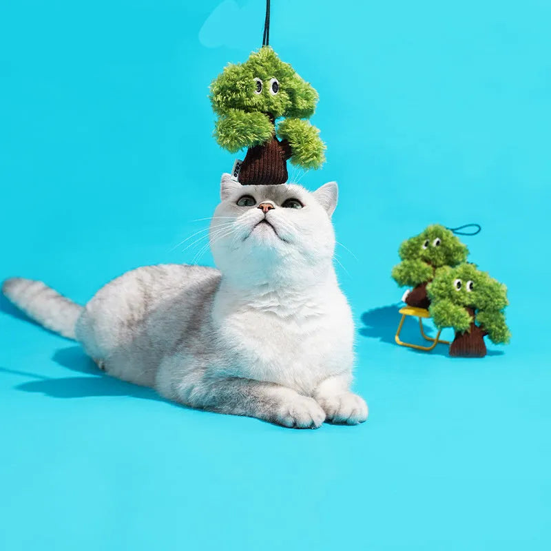 Pine tree shaped cat toy stick with an attached mint-scented bag pendant on a string.