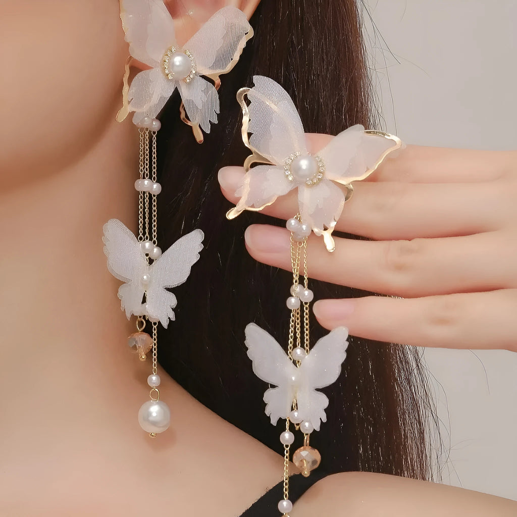 White butterfly earrings with tassel lace, pearl and rhinestone decorations on copper alloy