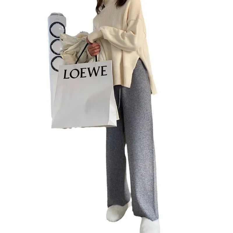 Women's high waist knitted wide-leg trousers in black colour showing straight-leg drooping style