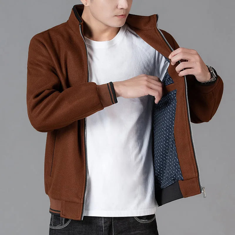 Men's grey zip-up fleece jacket with a stick pocket, shown in a sports style.