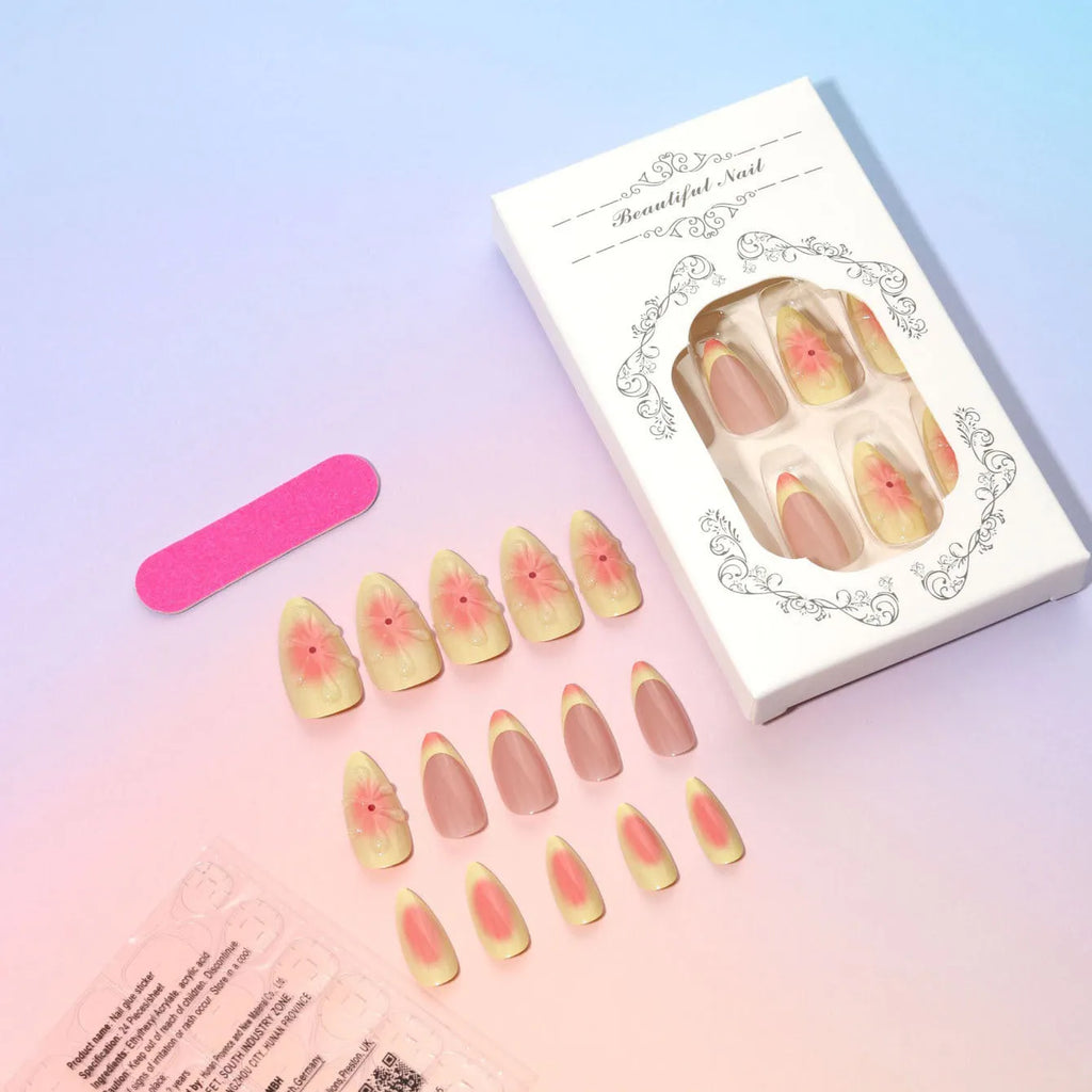 Set of simple fake nails with pink and white cartoon 3D flower charms on a wearable armour base.