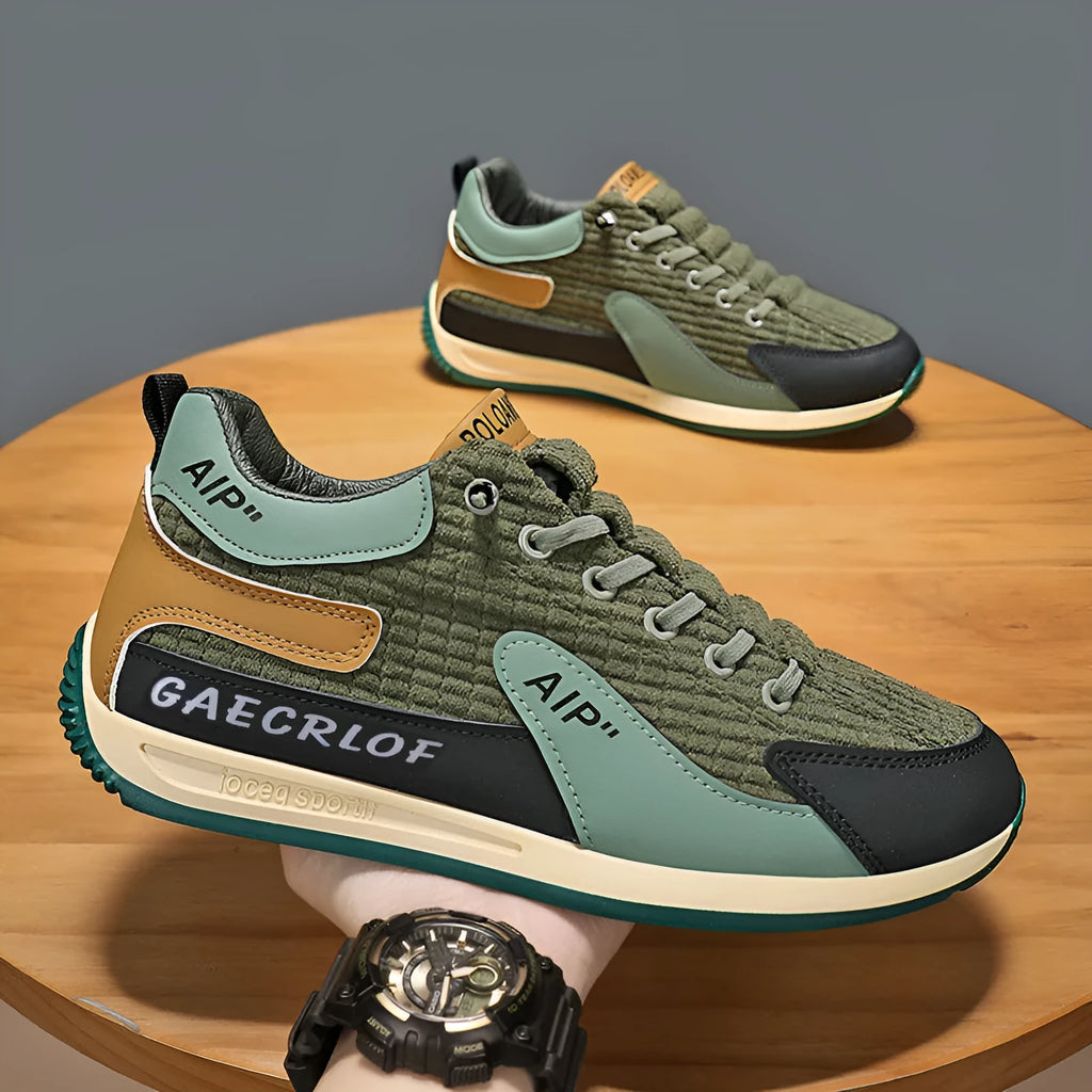 Men's lightweight mesh running shoe in green or grey with lace-up front and round toe