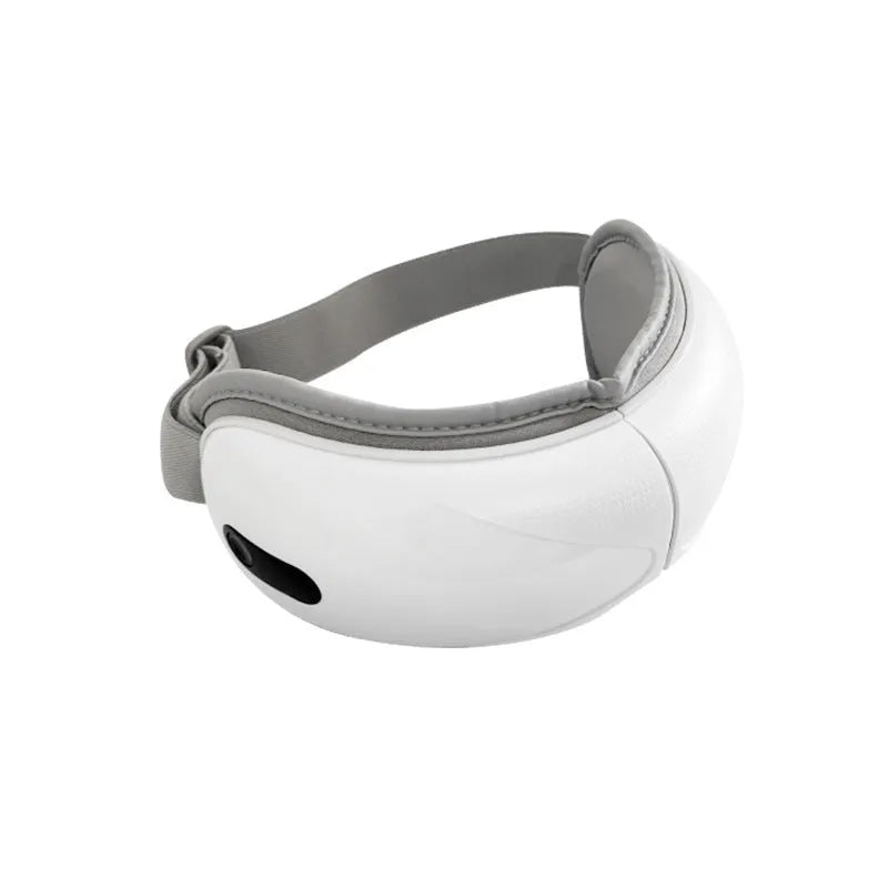 White rechargeable eye massager with airbag massage and hot compress functions showing compact design