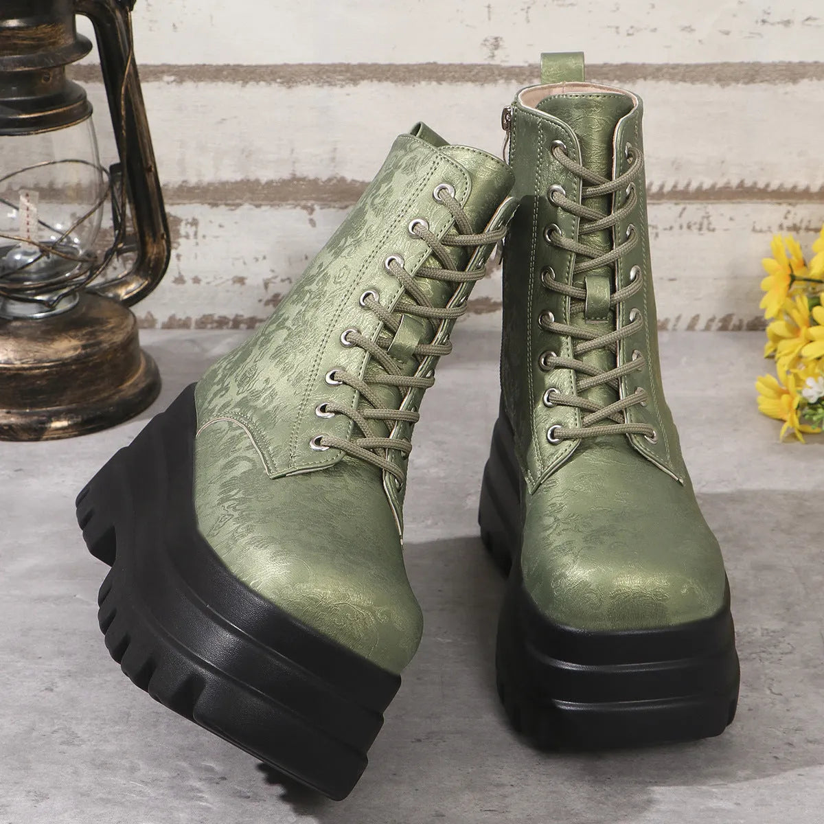 Women's black retro platform boots with patchwork design, chunky heel, and side zipper.