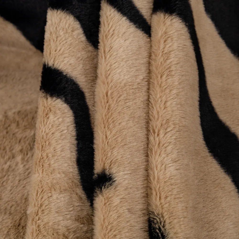 Zebra pattern flannel sofa cover with non-slip design on furniture
