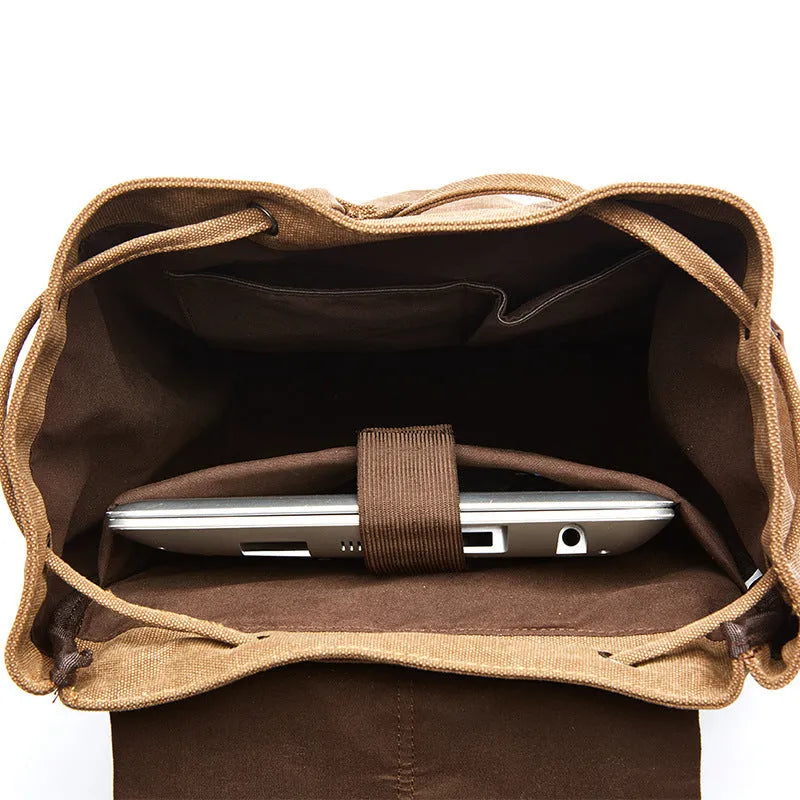 Canvas travel backpack in khaki with air pillow straps and stitched detailing