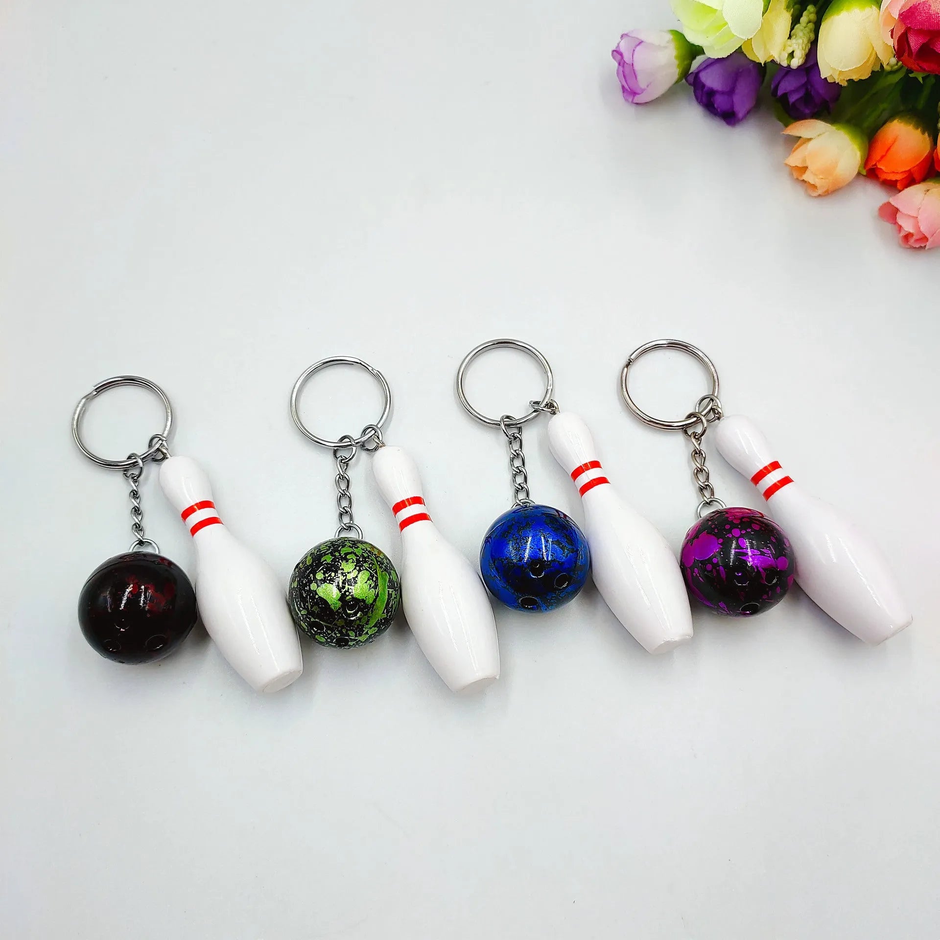 Mini bowling ball keychain pendant in blue colour with metal ring