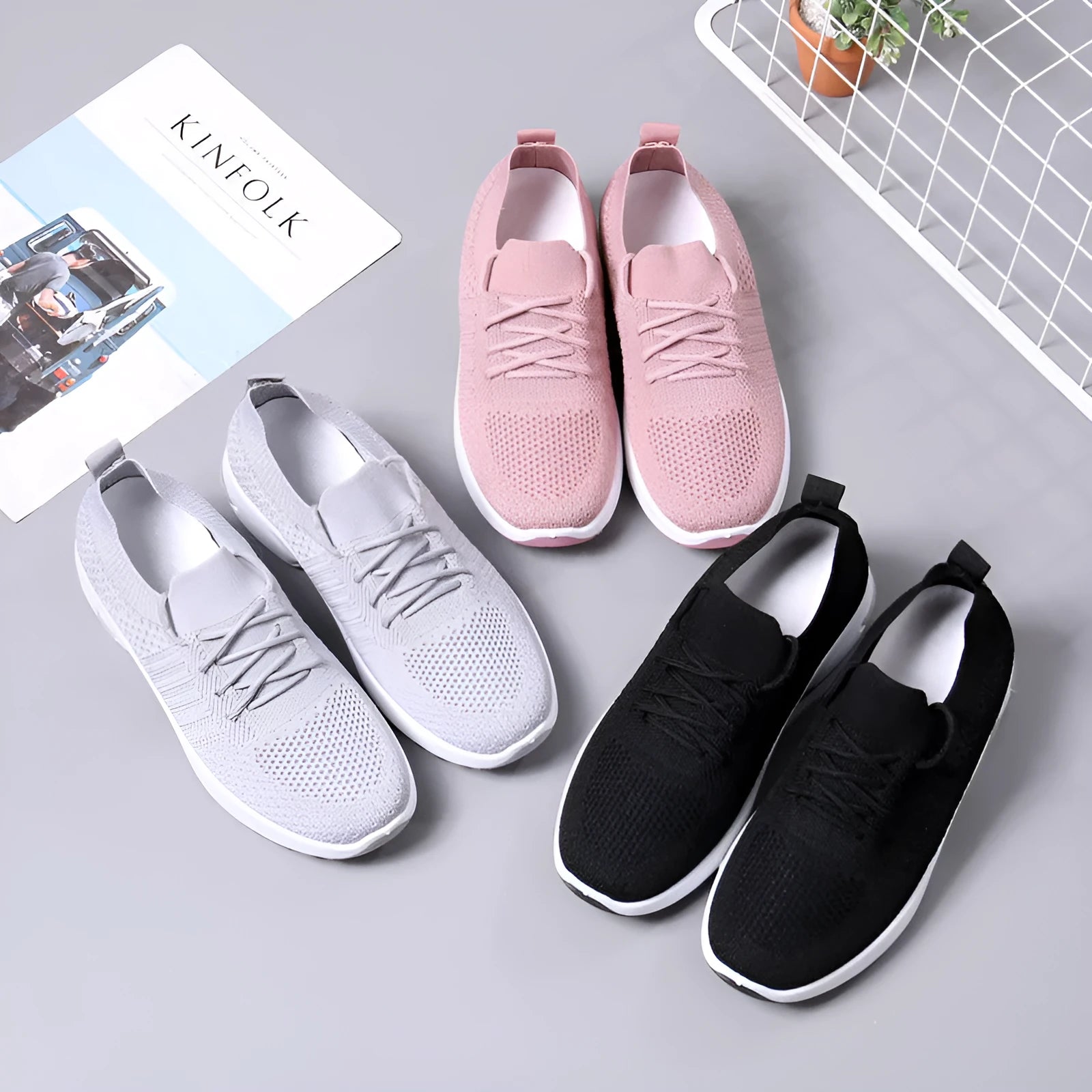 Women's black casual sneakers with mesh upper, lace-up front and soft PVC sole