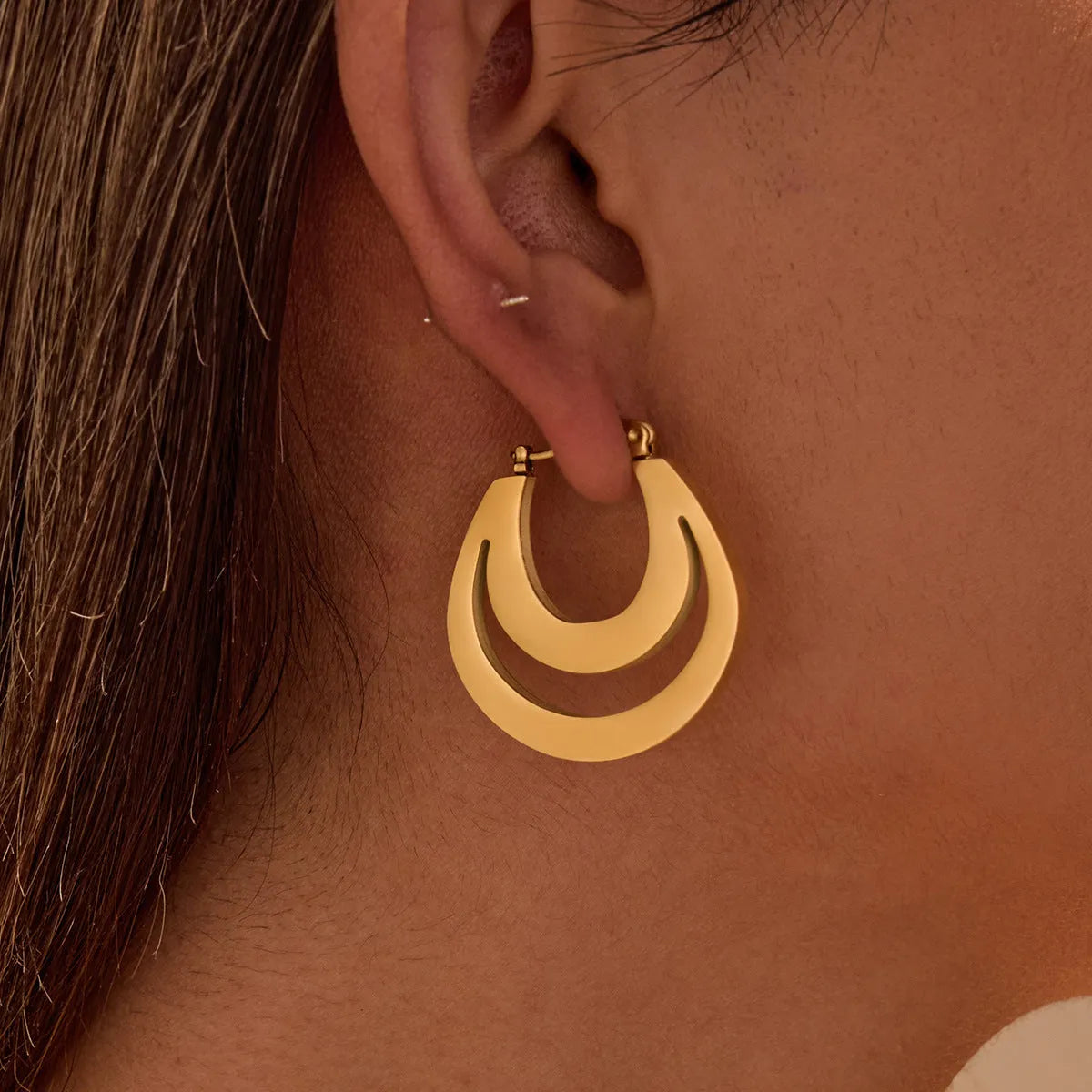 Geometric circular French earrings with gold plating on stainless steel, minimalist design