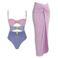 Women's solid colour one-piece swimsuit with matching skirt and gold button detailing