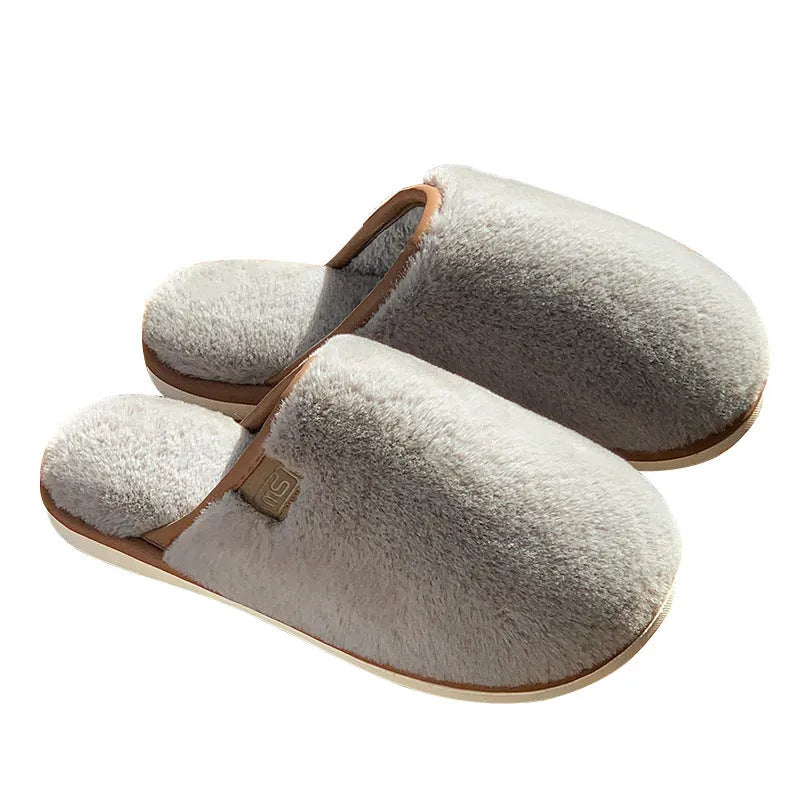 Solid colour winter plush slippers with PVC construction and non-slip sole