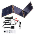 Black foldable portable solar panel unfolded, showing three monocrystalline cells, with included car charger and cables.
