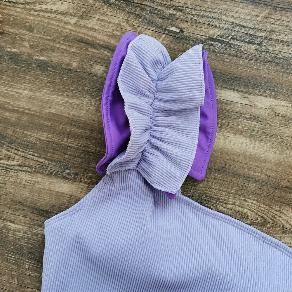 Single-shoulder high waist one-piece swimsuit for women in solid colour.
