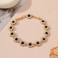 Electroplated zinc alloy bracelet with flower-shaped coloured gemstone charm in gold and silver colour variations