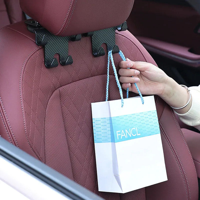 Black car multifunction hook with integrated phone holder for rear seat storage