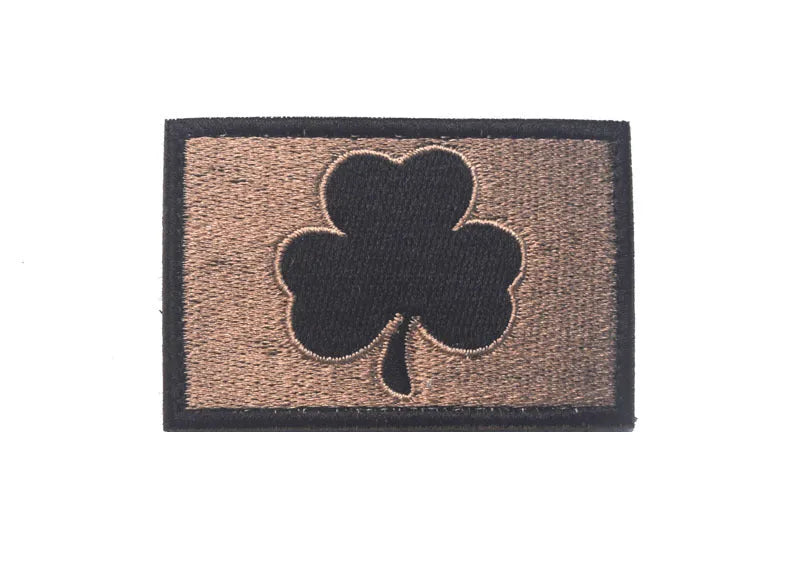 Outdoor embroidered fabric badge with Velcro backing on a tactical vest.