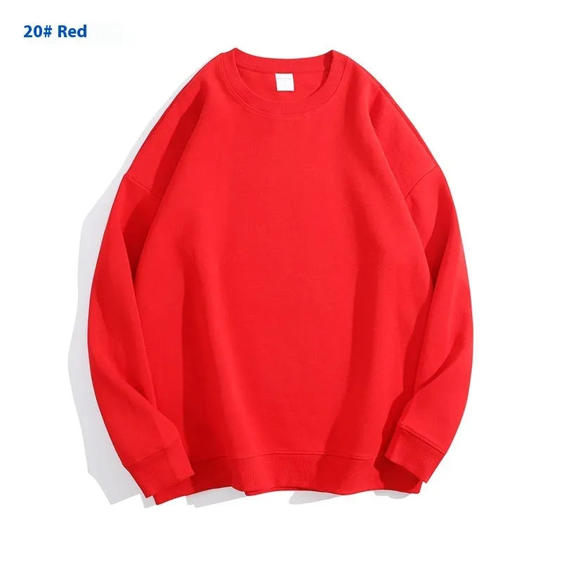 A loose round neck off shoulder pullover sweater in a solid colour, with long sleeves.